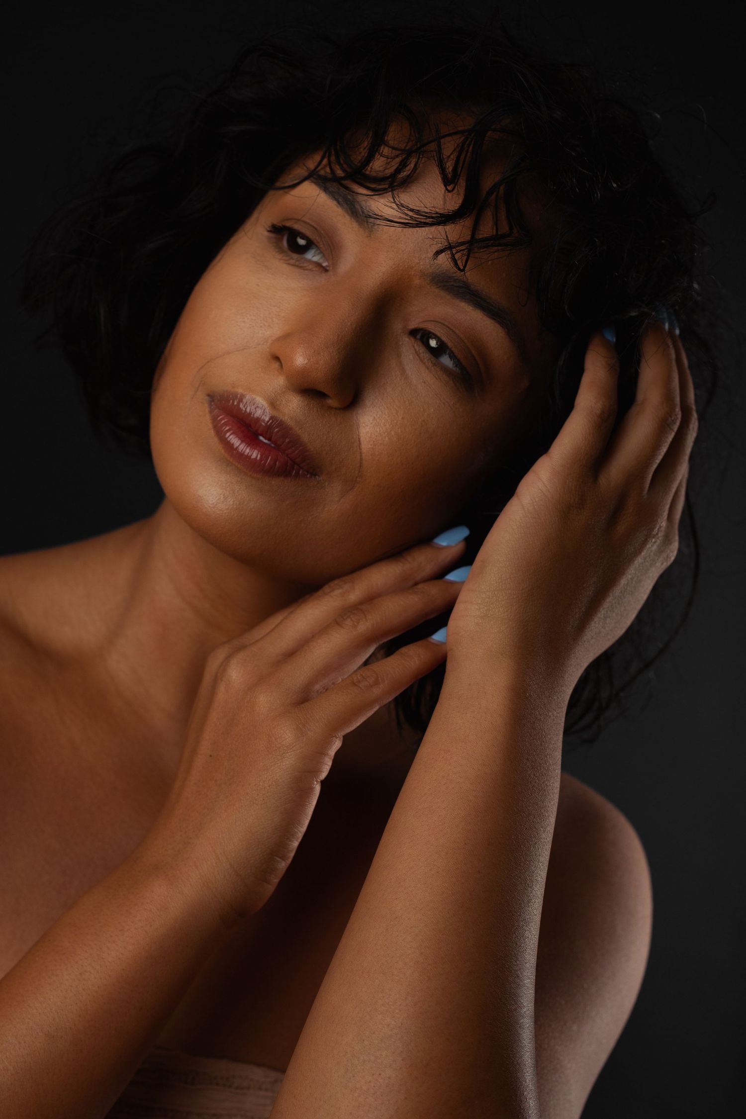 Female model posing in elegant studio portrait session in Phoenix Arizona