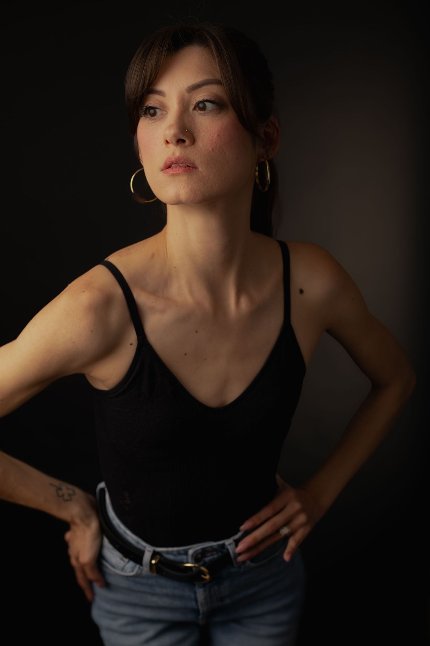 Female model posing in elegant studio portrait session in Phoenix Arizona