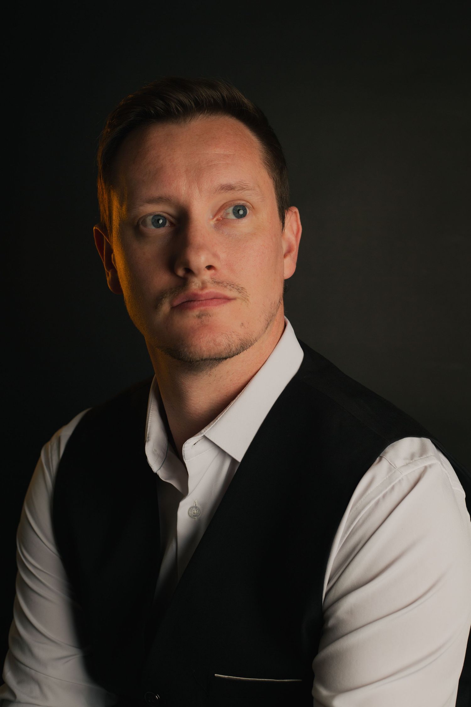 Male posing in dramatic  elegant studio portrait with in Phoenix AZ.