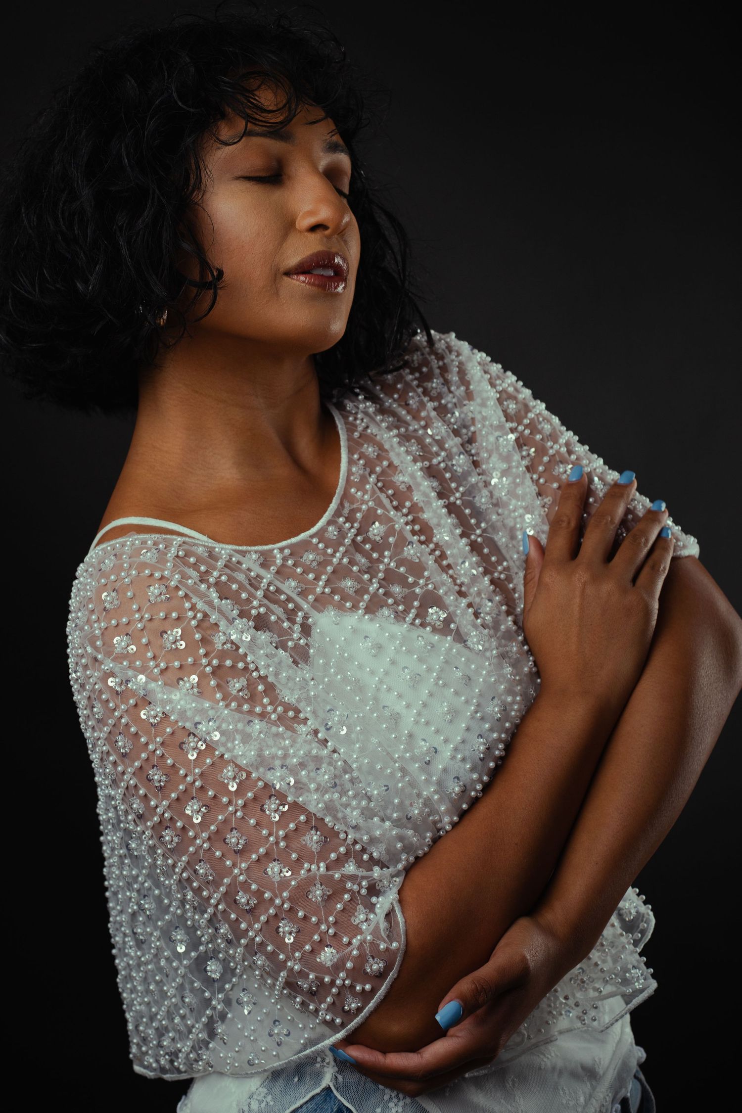 Female model posing in elegant studio portrait session in Phoenix Arizona