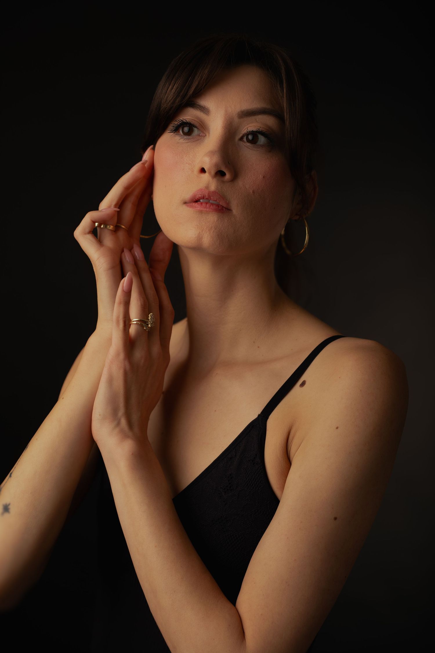 Female model posing in elegant studio portrait session in Phoenix Arizona