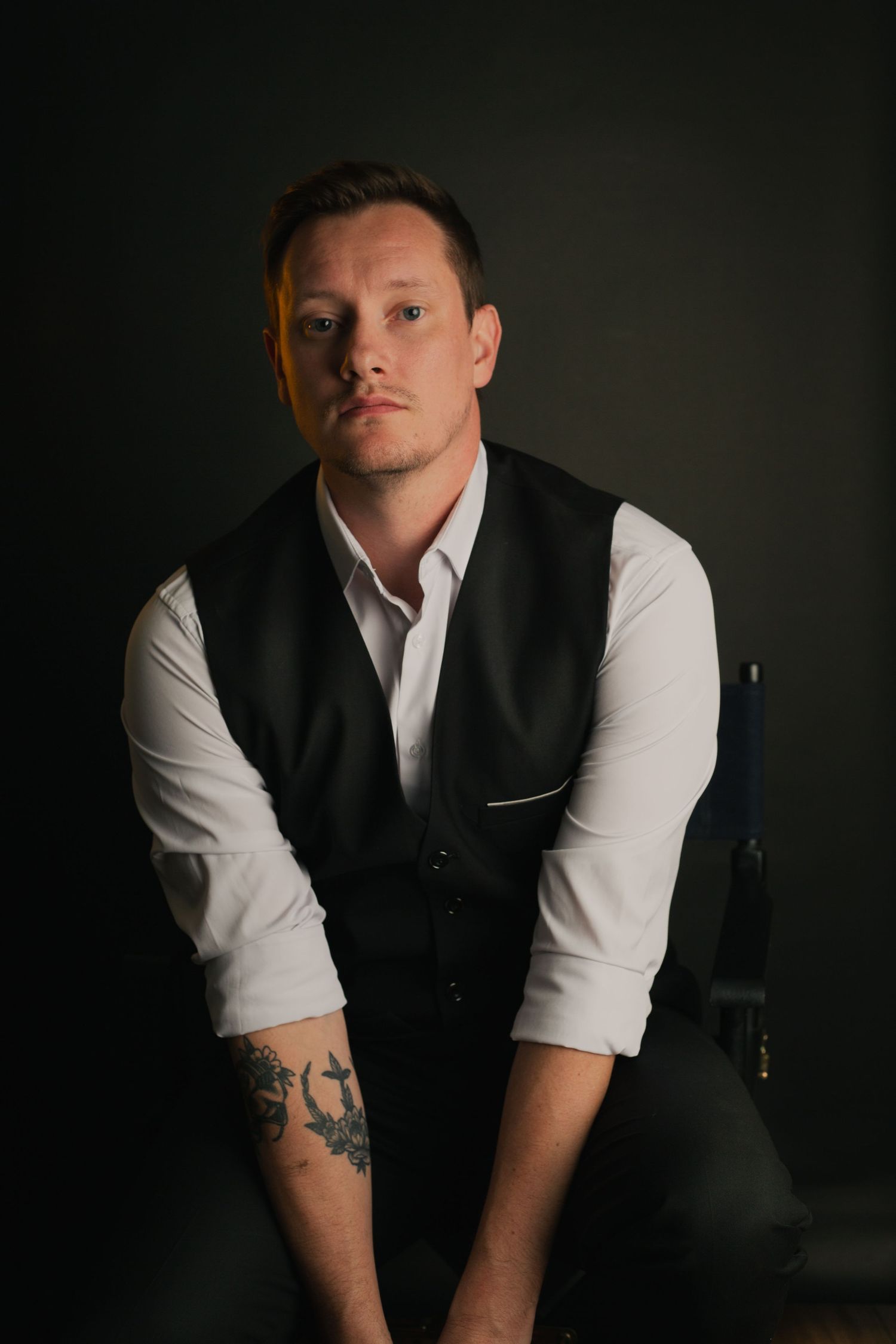 Male posing in dramatic  elegant studio portrait with in Phoenix AZ.