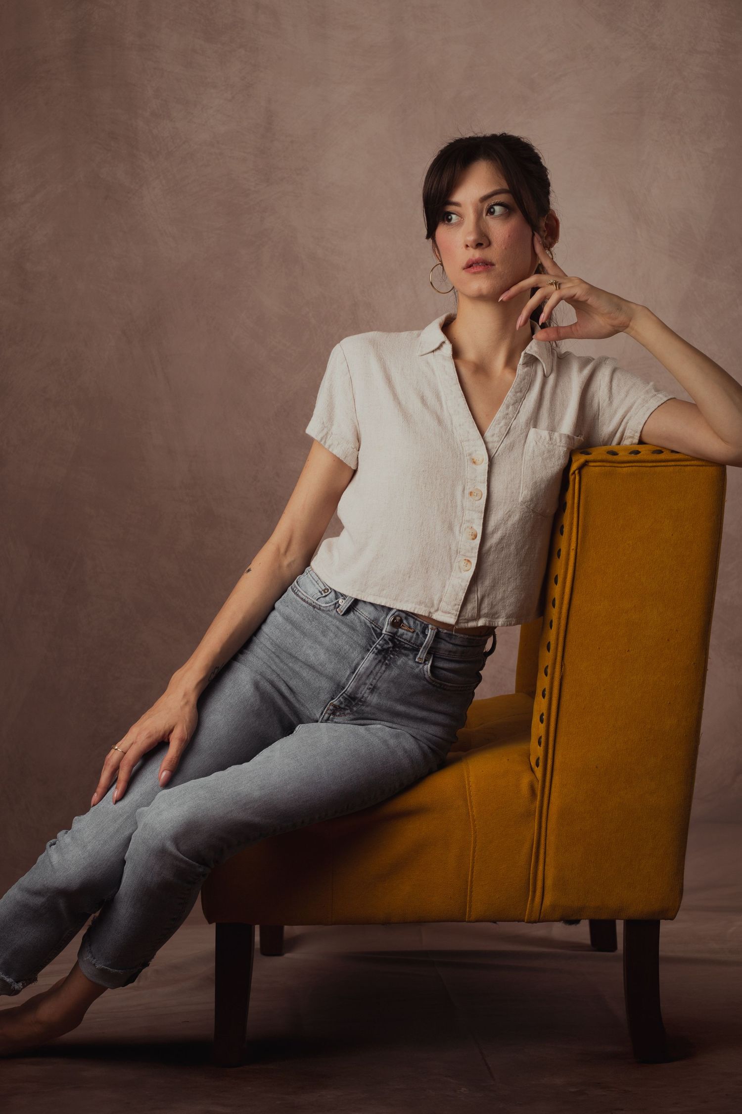 Female model posing in elegant studio portrait session in Phoenix Arizona