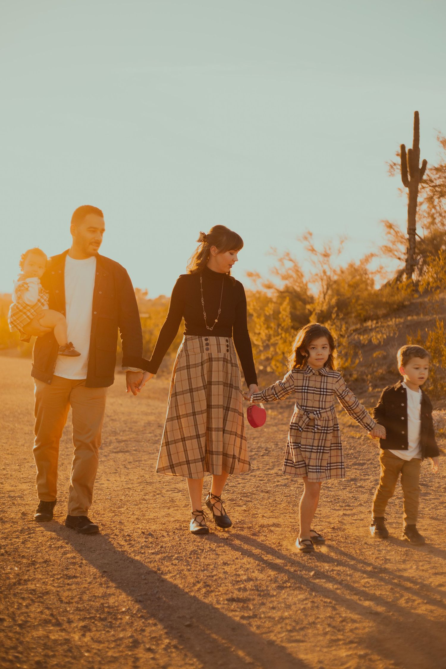 Family of five posing in desert landscape in Phoenix AZ