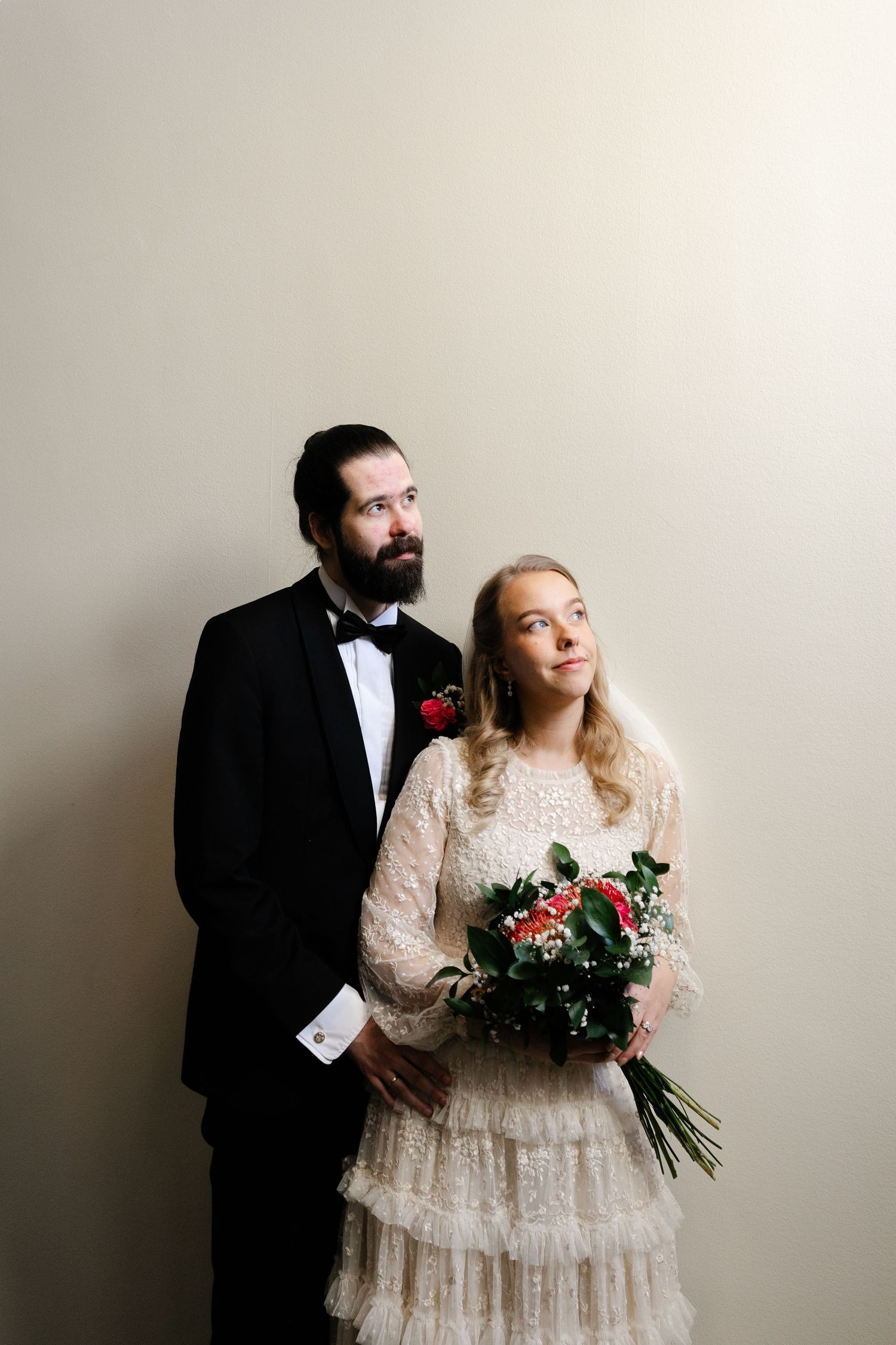 Wedding portrait series against white background showing couple in formal attire.