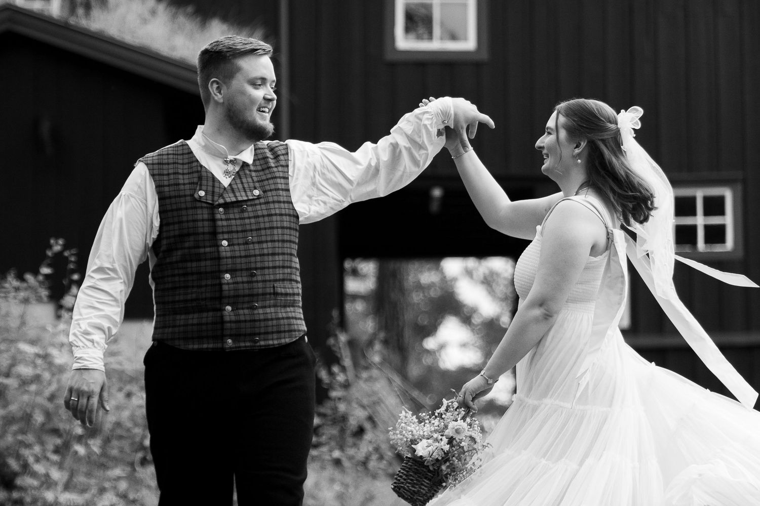 A black and white wedding photo montage showing romantic moments between newlyweds during their celebration.