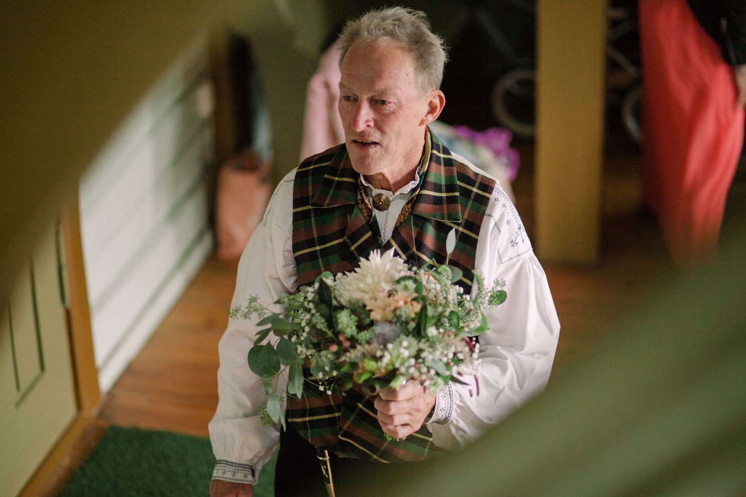 Wedding preparations with floral bouquet and formal attire.