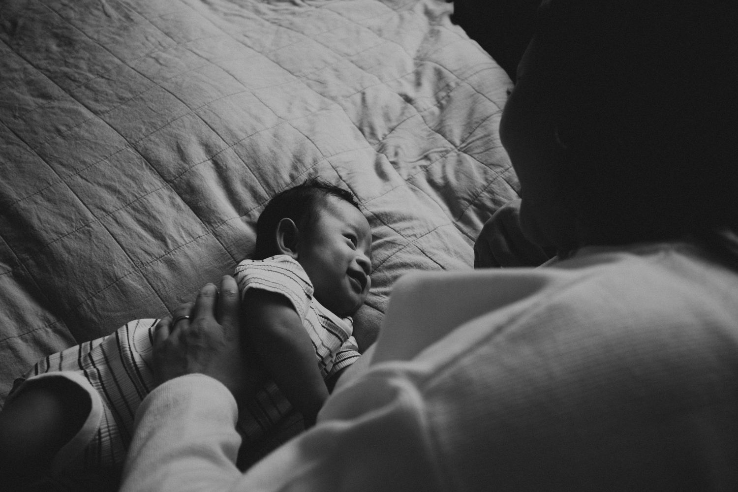 Intimate black and white portrait series showing tender moments between a couple.