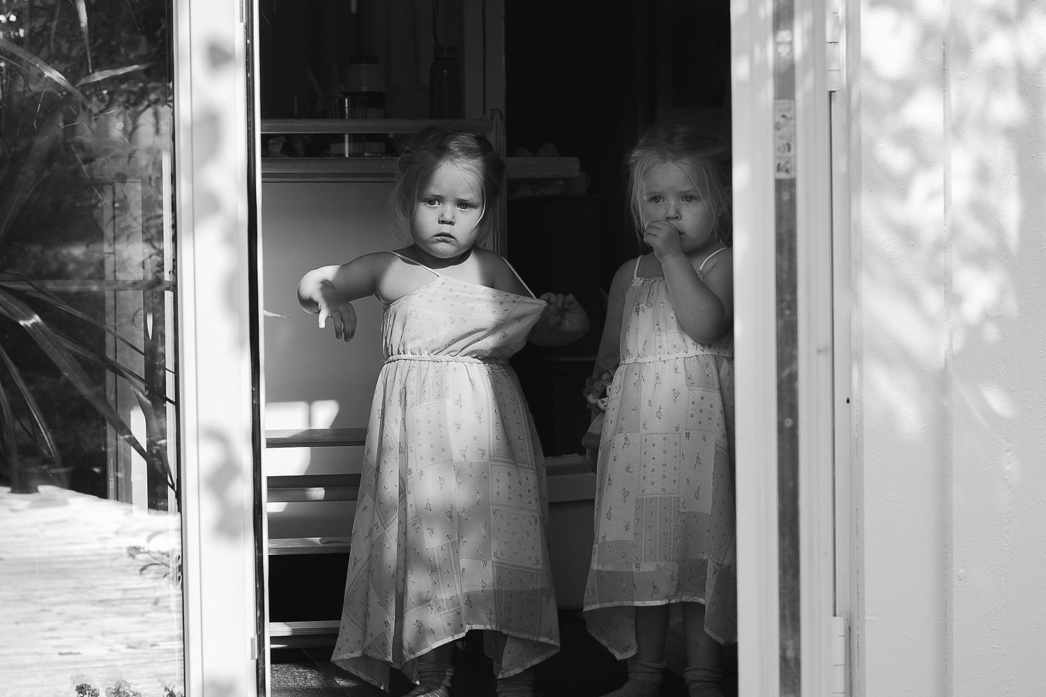 Black and white images showing sunlight and shadows through window panes.