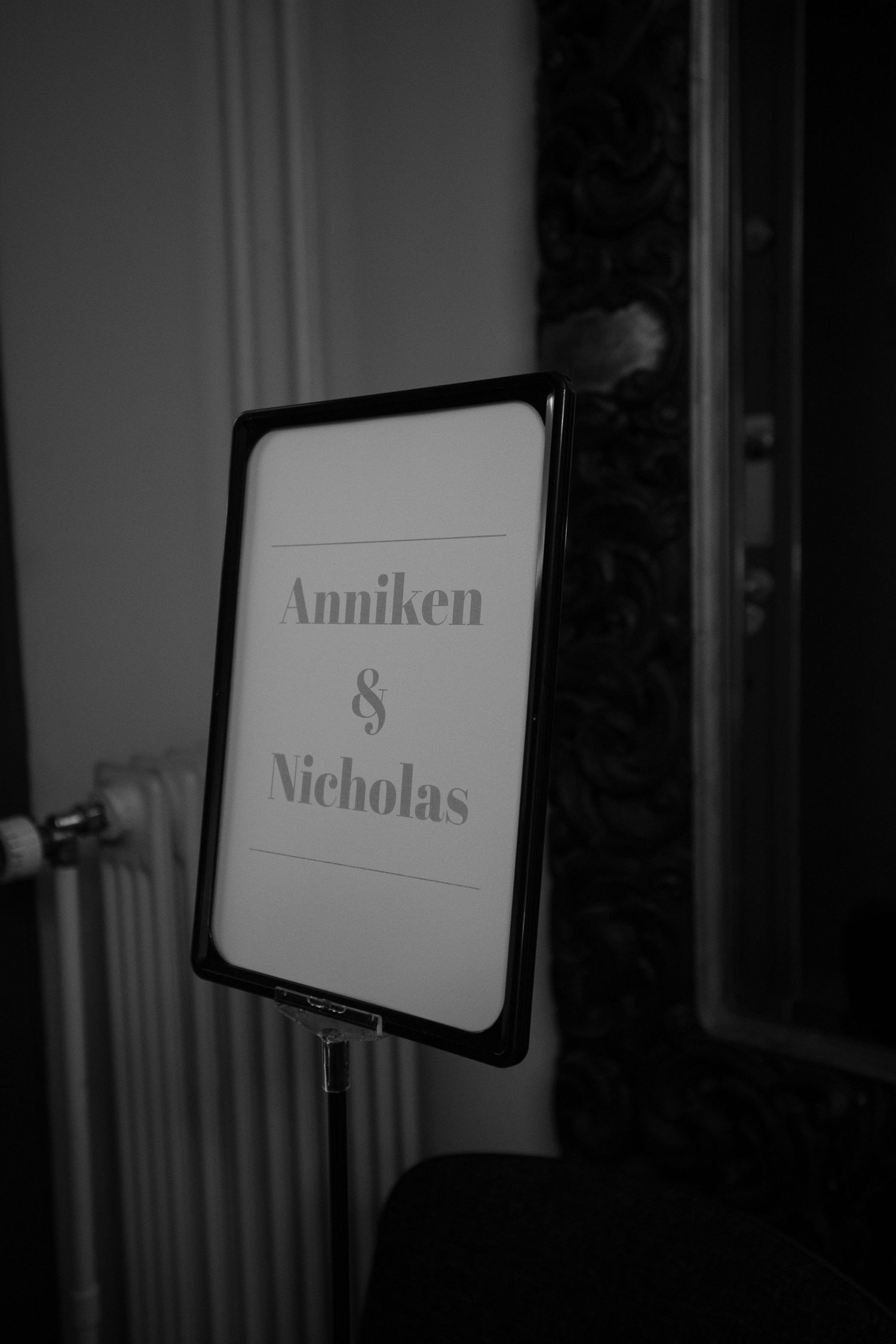 Wedding signage displayed in elegant typography against a dark background.