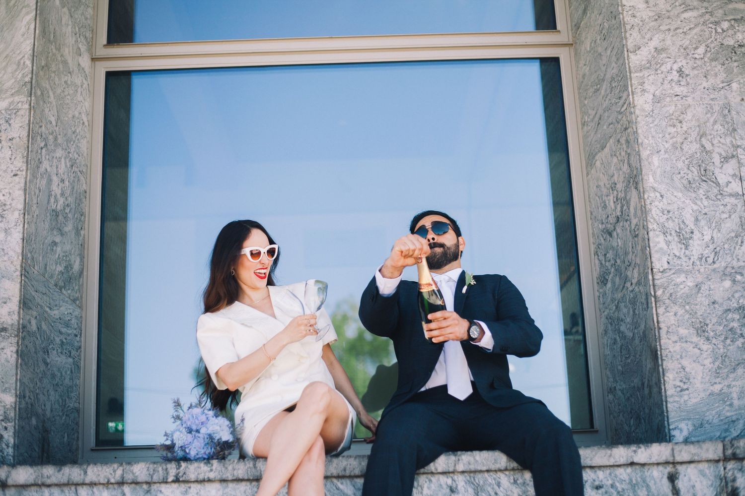 A wedding photo collage showing a couple posing playfully on stone steps in formal attire.