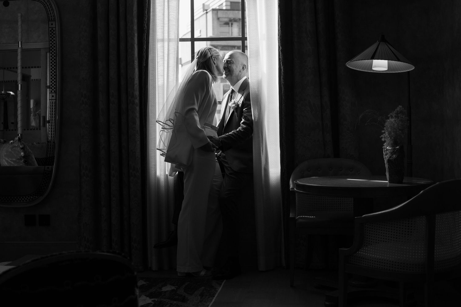 Artistic black and white photo series showing a room with window light and lamp.