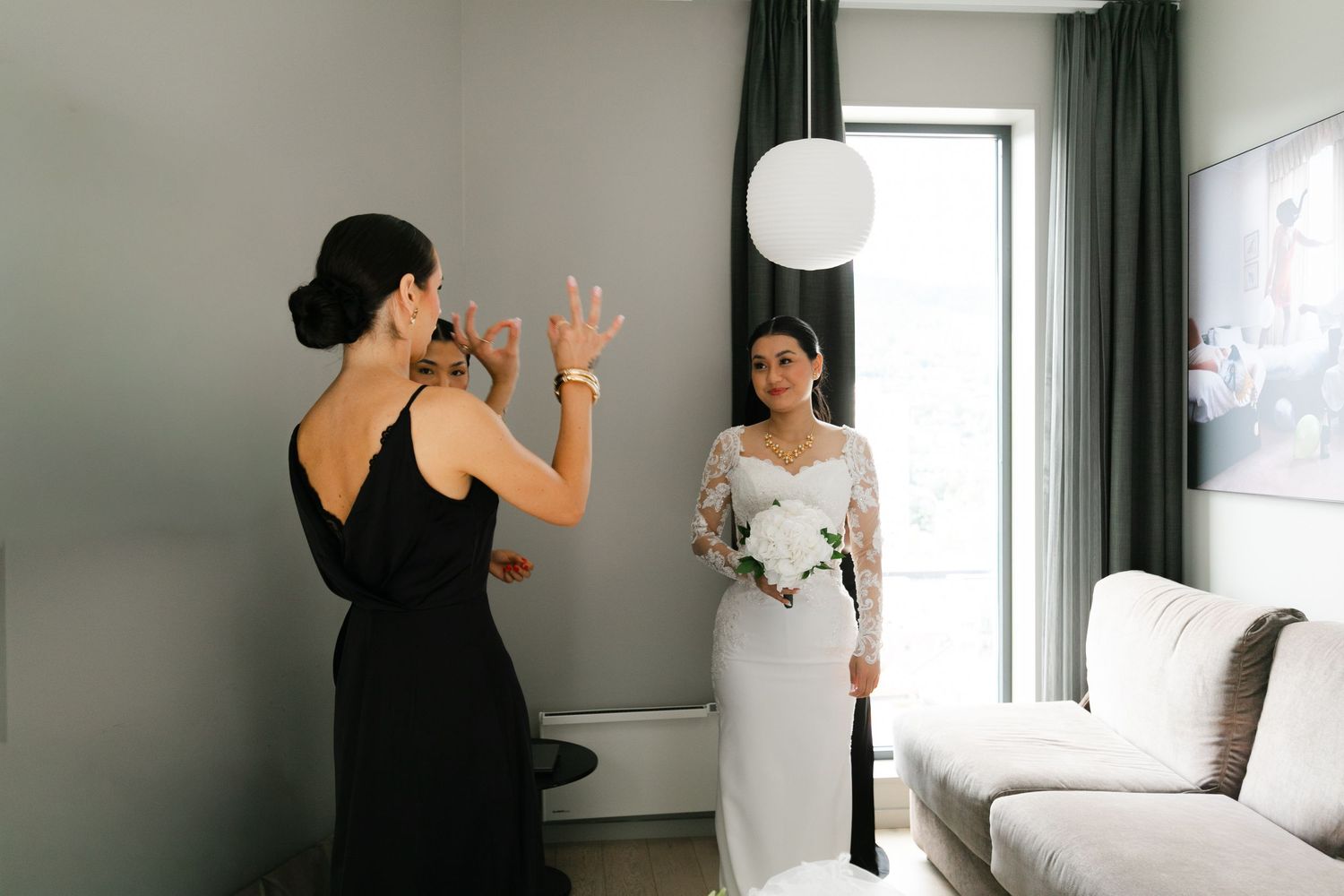 Wedding morning preparations in a bright room with natural window light.