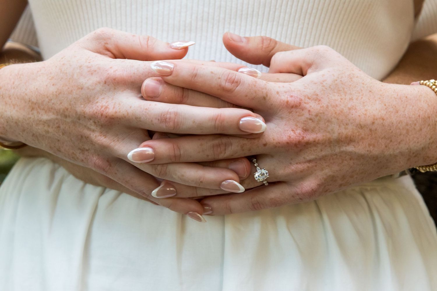Close-up of hands with engagement ring showing different poses and details.