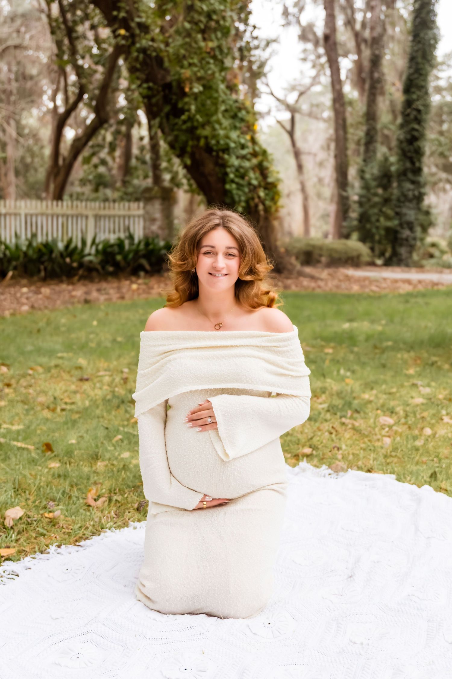 A maternity photo progression shows a growing baby bump in an off-shoulder white dress against a natural outdoor setting.