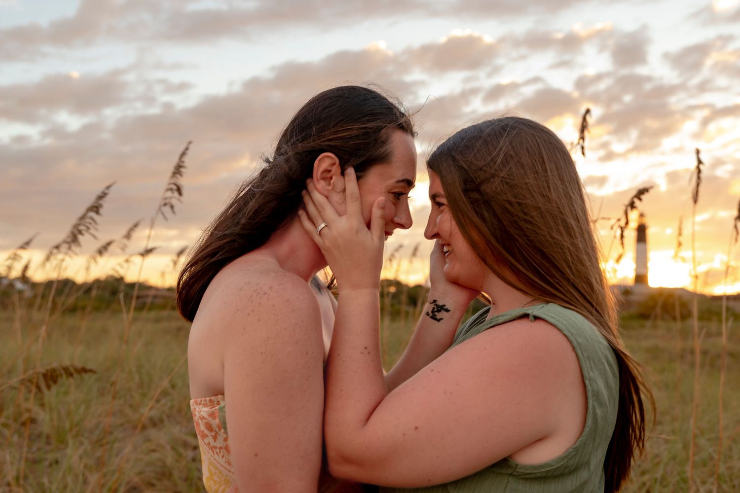 Intimate sunset portrait in tall grass with golden light.