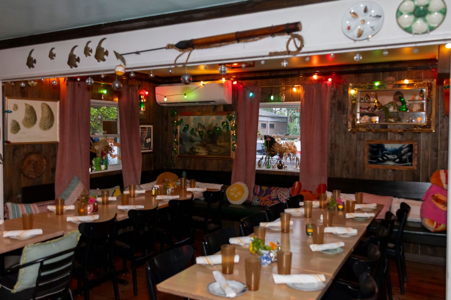 Interior view of a rustic restaurant with warm lighting and wooden decor.