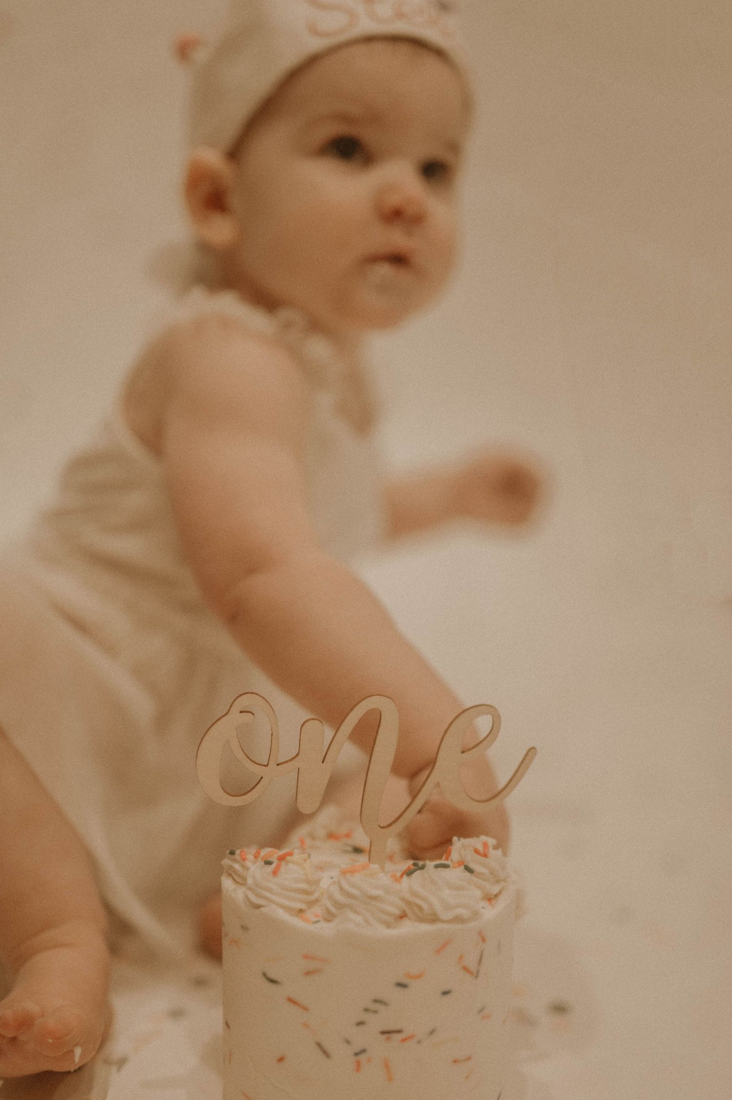 A small white birthday cake with 