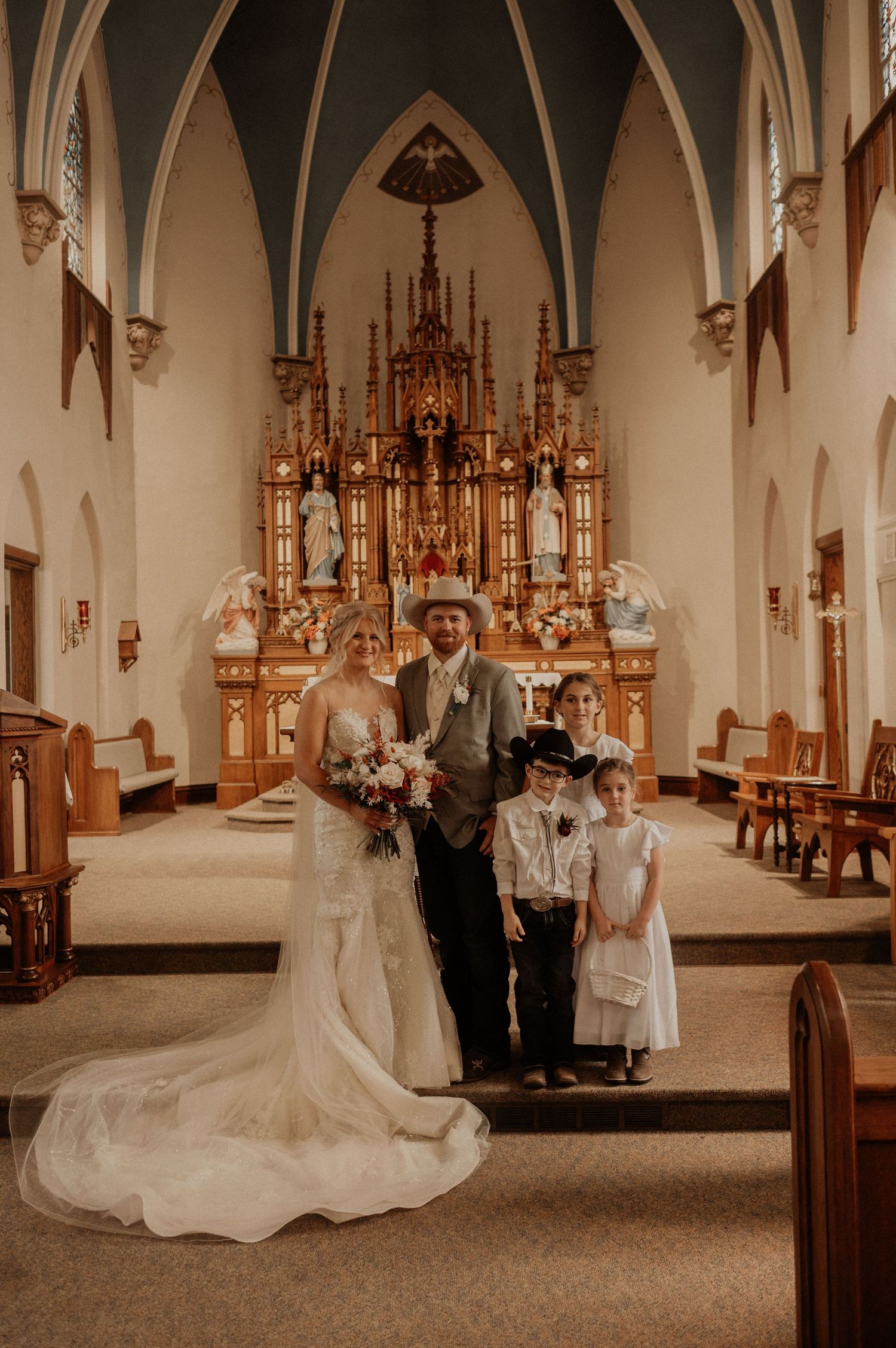A wedding ceremony scene in a Gothic-style church with vaulted ceilings.