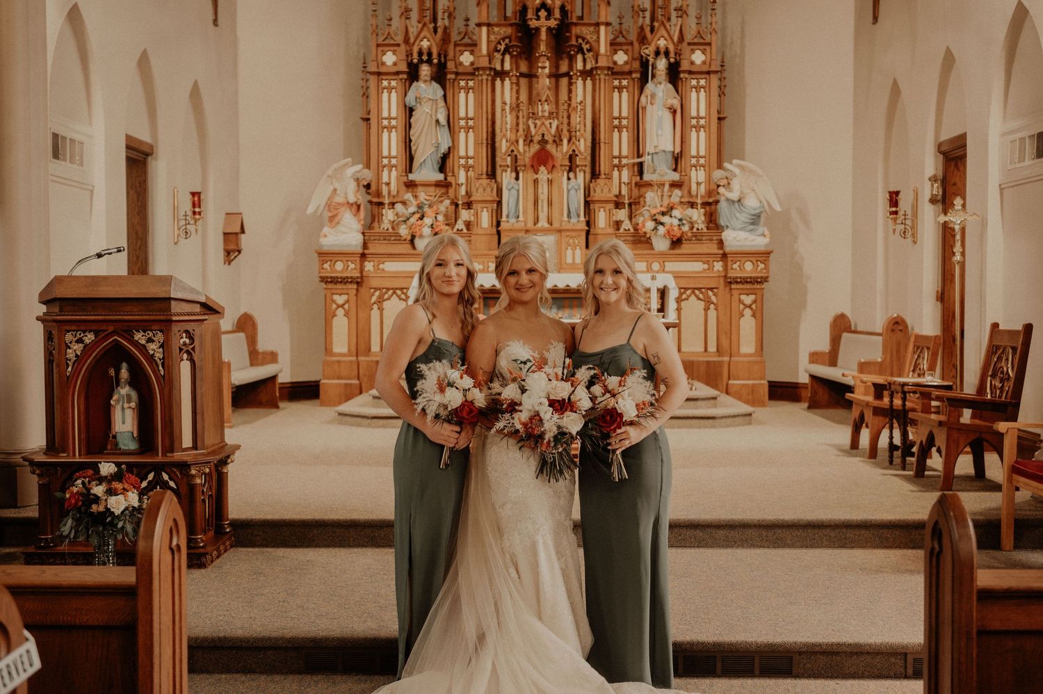 Traditional church wedding ceremony with decorative floral arrangements and classic architecture.