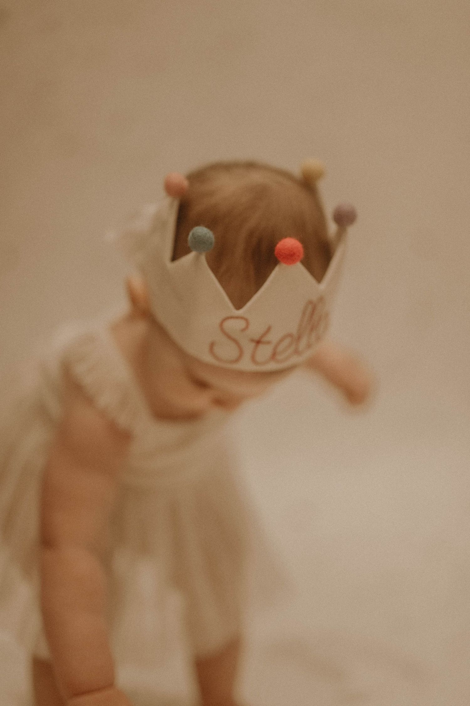 Blurred vintage-style photographs arranged in a row showing abstract shapes and text in warm sepia tones.