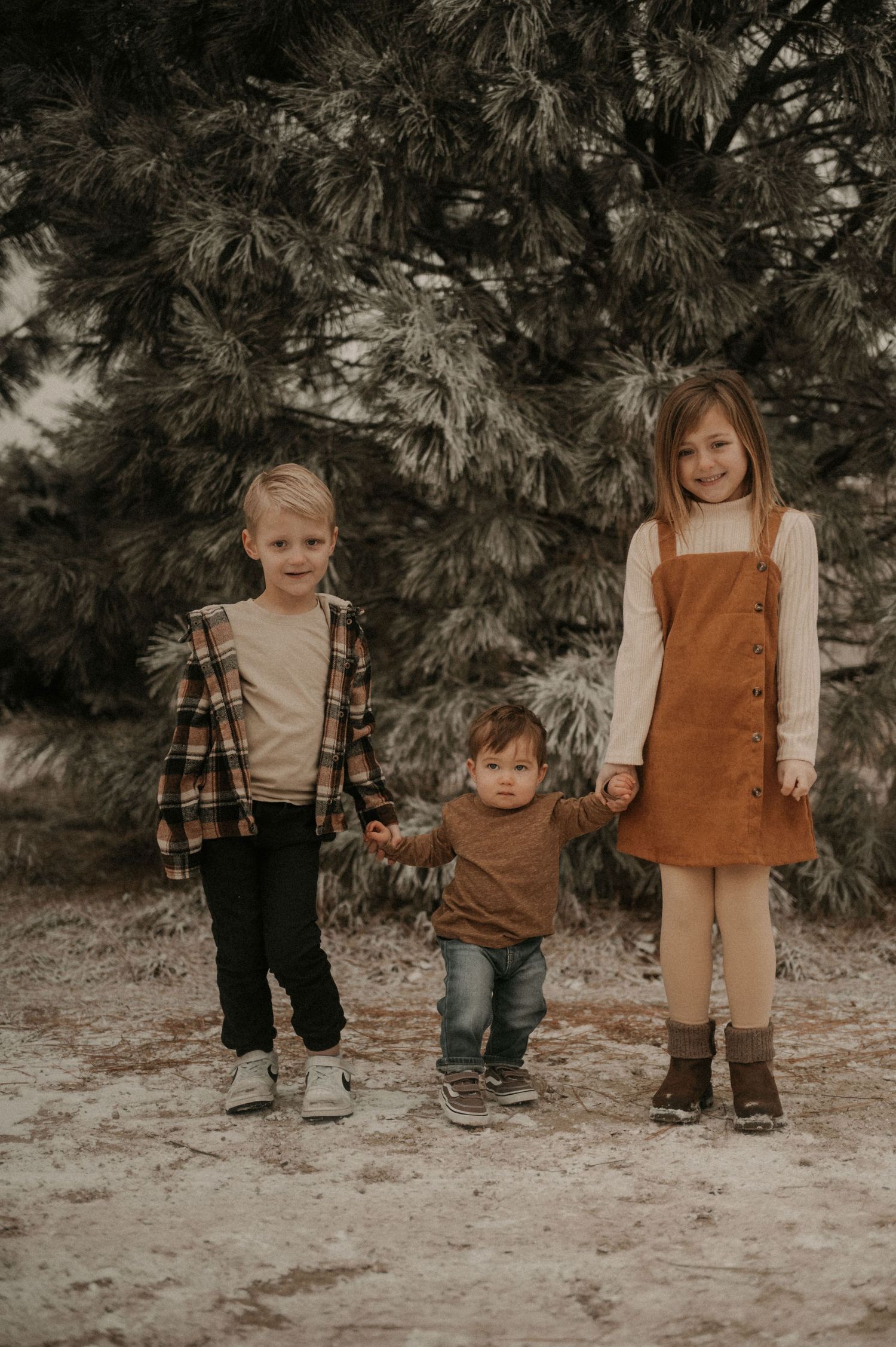 A series of cropped photos showing small children's legs wearing brown and beige coordinated winter outfits in a forest setting.