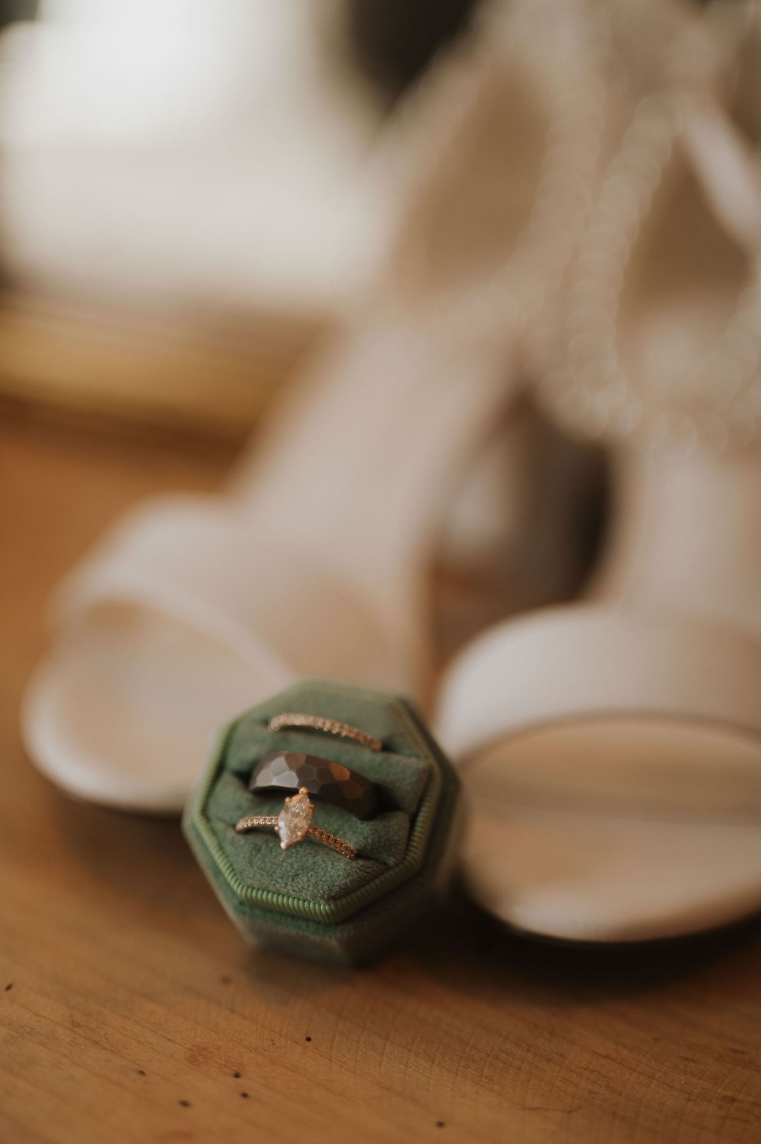 A series of macro shots showing a small green button with a dog silhouette pattern transitioning into soft focus.