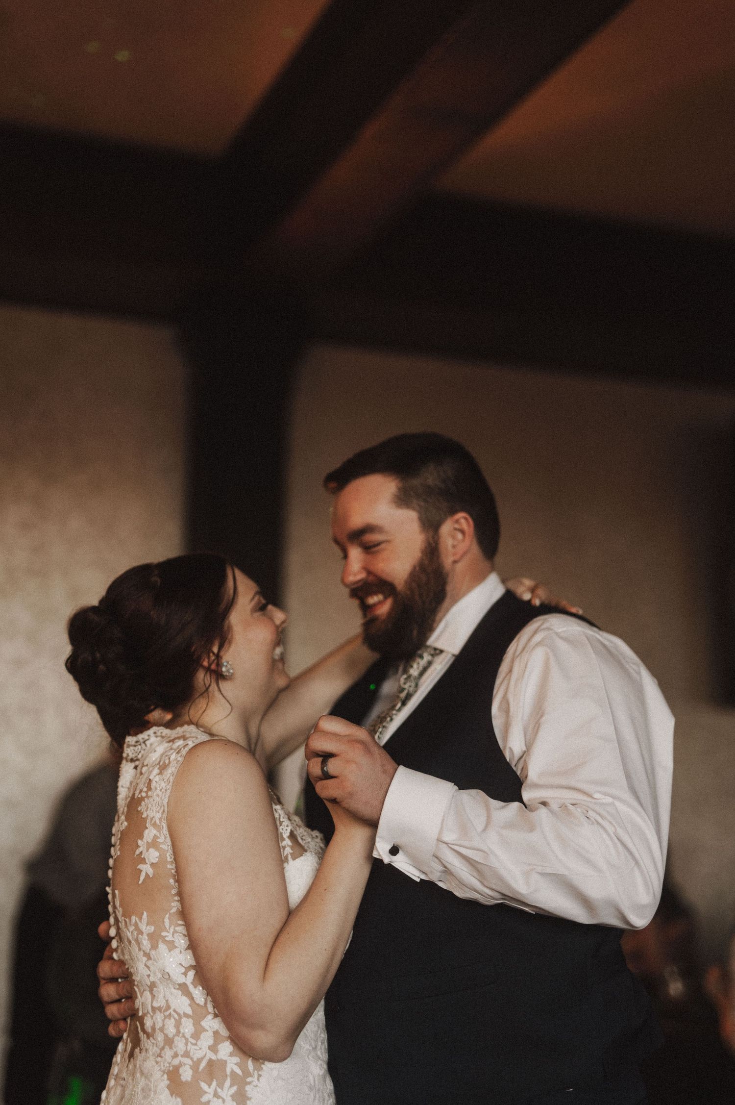 Couple shares a romantic slow dance at their wedding reception.