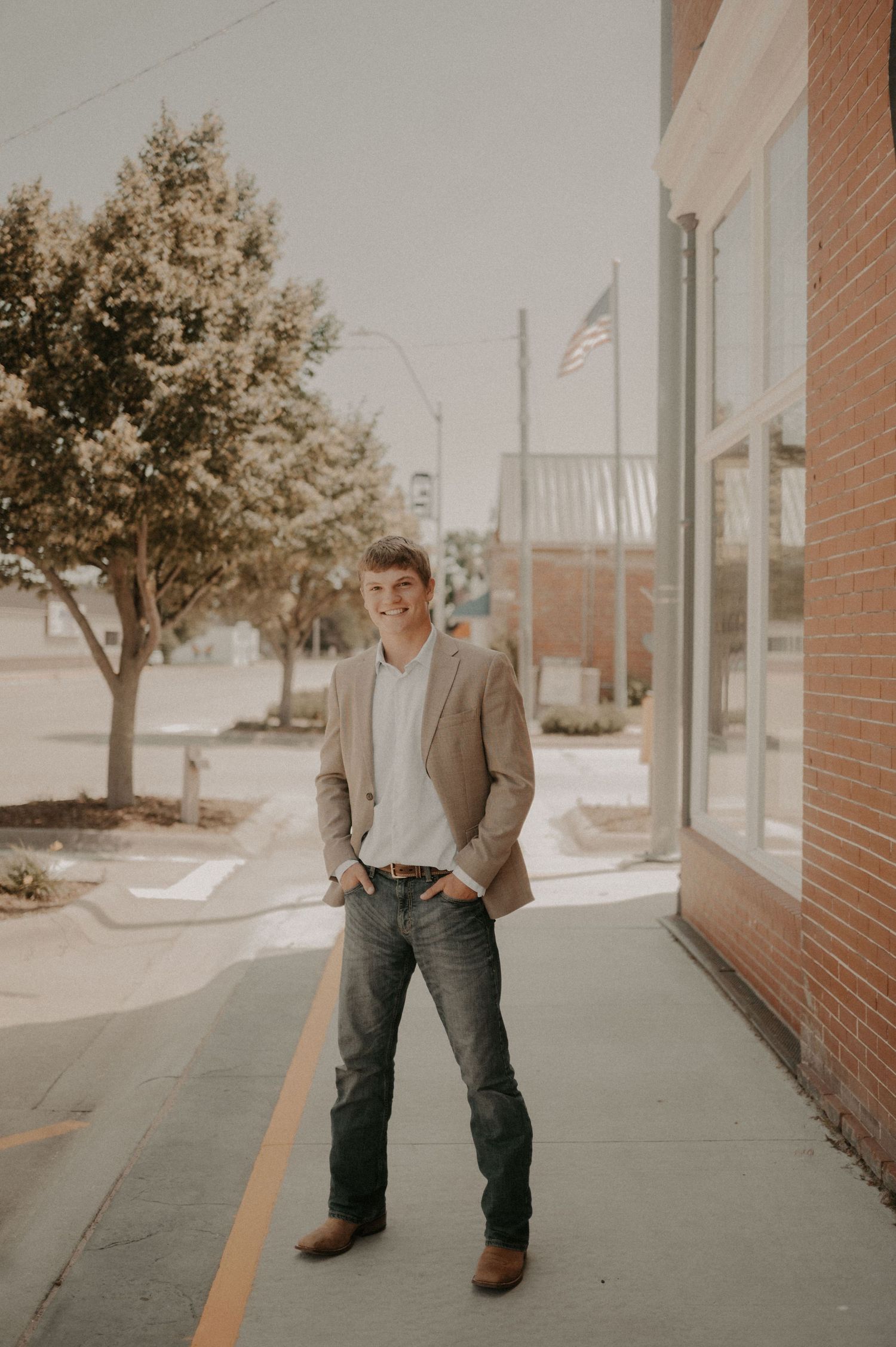 A series of three sepia-toned photos showing someone in a blazer and jeans walking along a brick sidewalk.