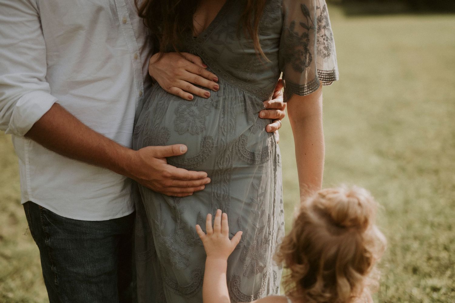 A series of candid outdoor photos showing tender family moments between parent and child in natural sunlight.