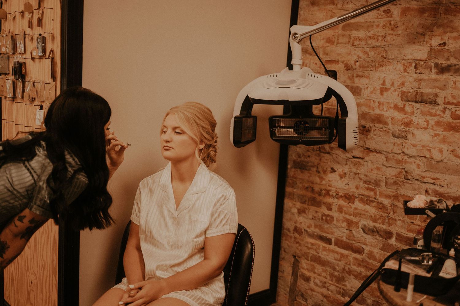Sepia-toned interior shots show a person getting ready in a room with exposed brick walls.