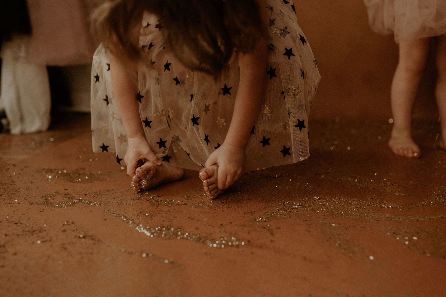 A sequence of images showing feet dancing and stepping on confetti during a festive celebration.