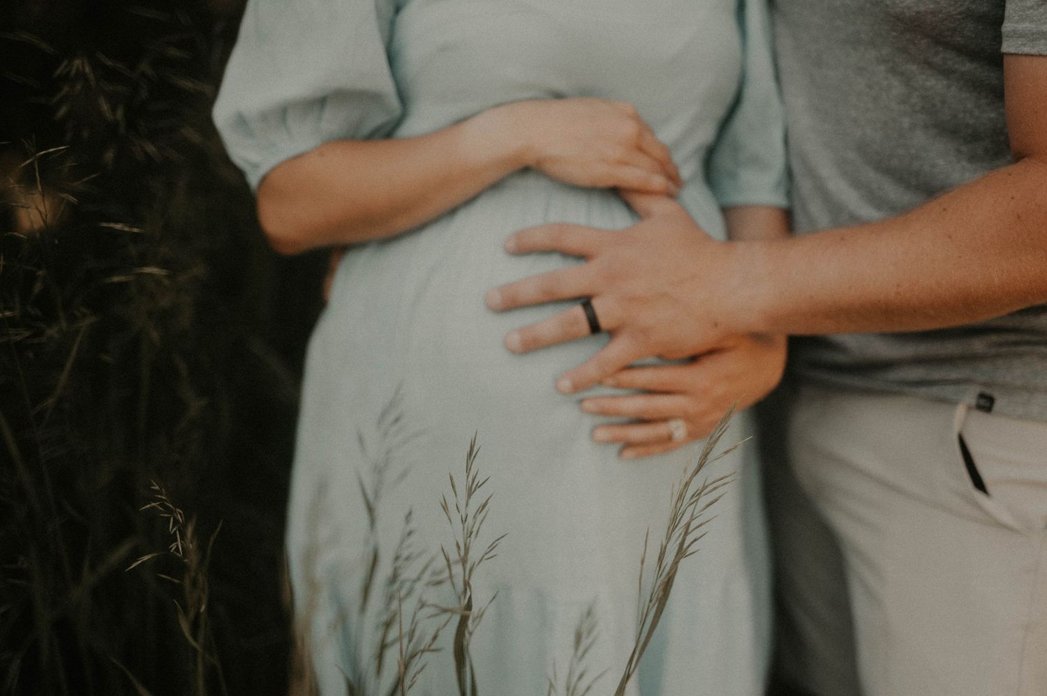 A series of cropped photos showing hands gently resting on a pregnant belly in soft, neutral tones.
