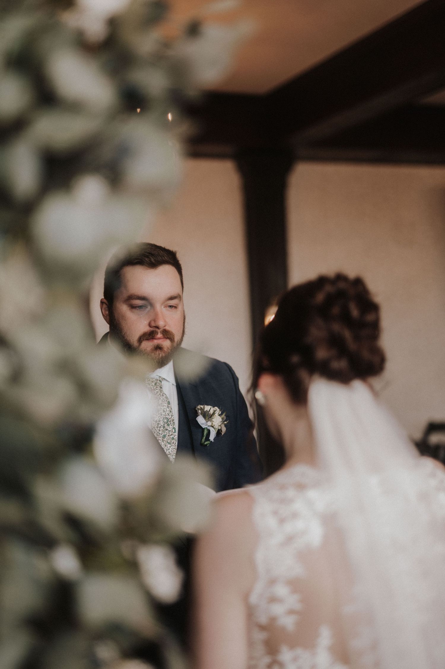 A romantic wedding moment captured in a soft, warm-toned sequence showing intimate interactions between the newlyweds.