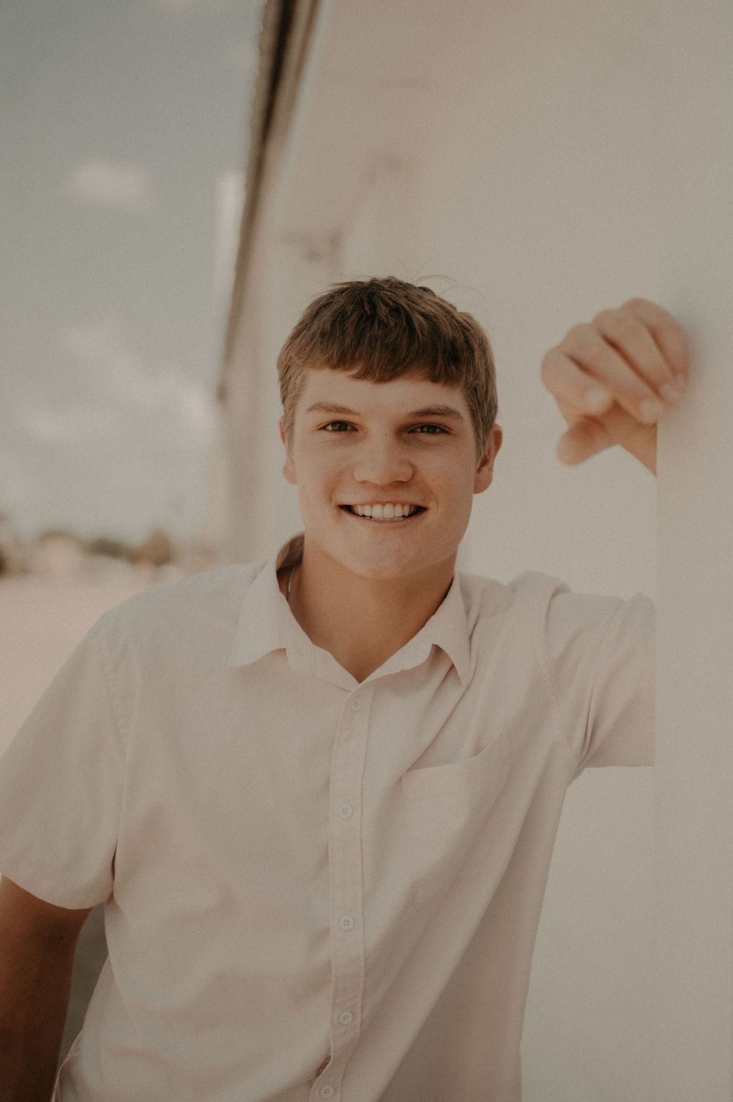 A series of four photos showing a person in a white polo shirt with a bright expression.