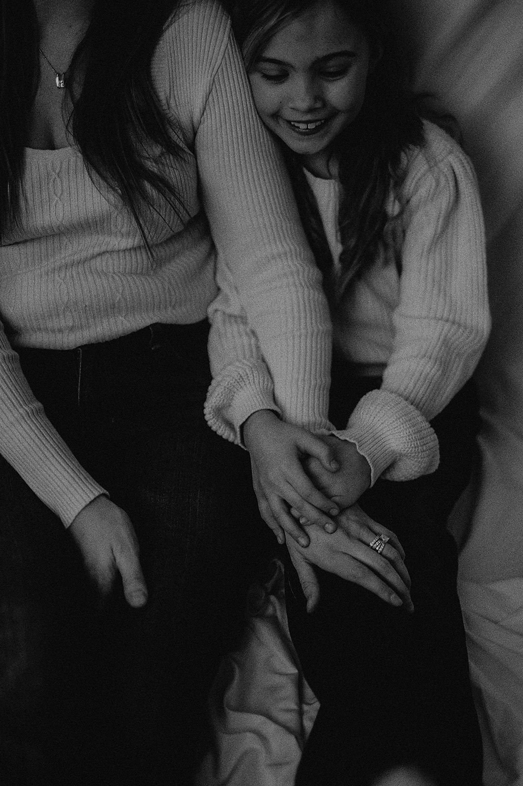Black and white sequence showing casual moments in a cozy sweater.