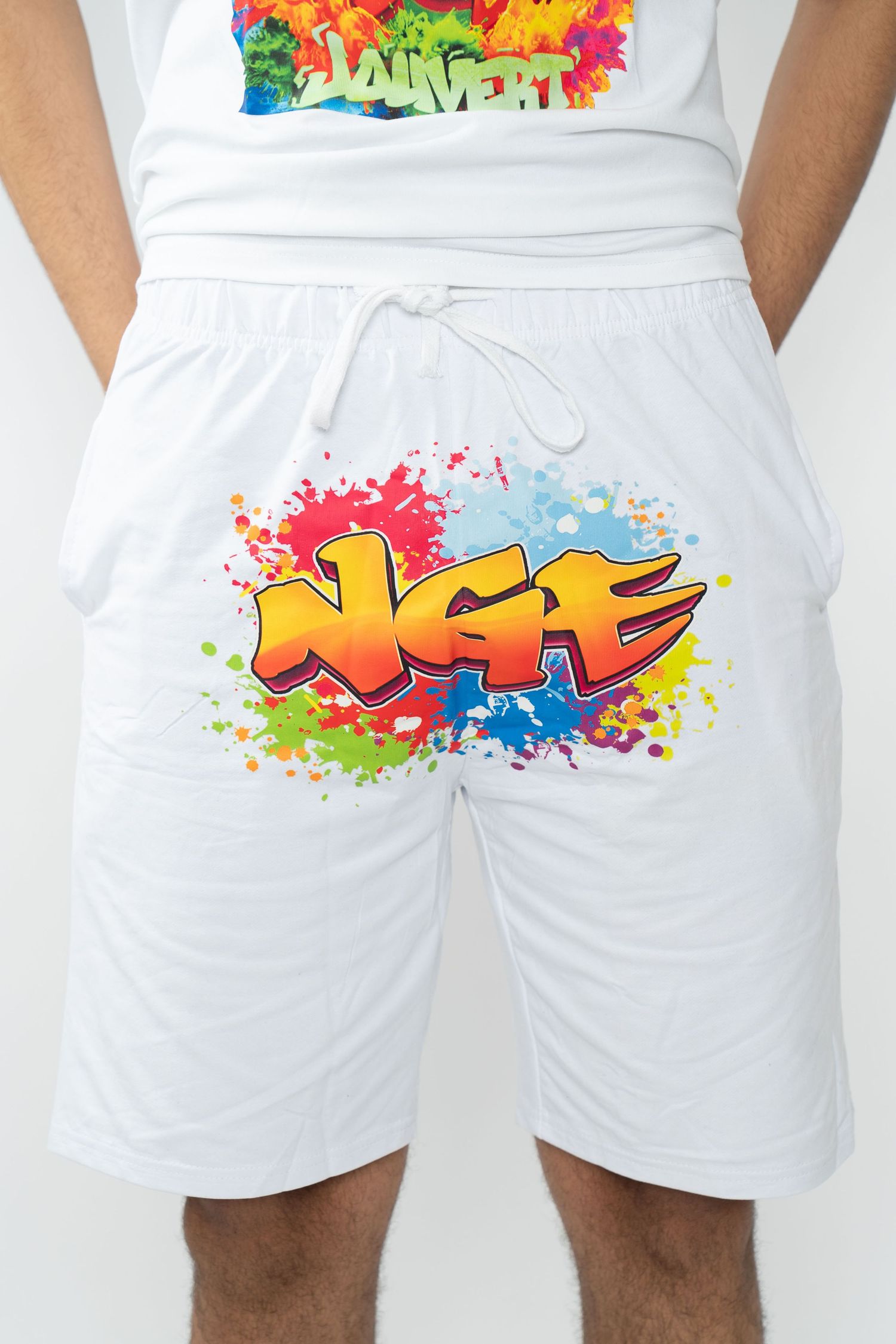White athletic shorts with colorful graffiti-style paint splatter designs on the side. Greater Boston Area photographer, Malden MA.