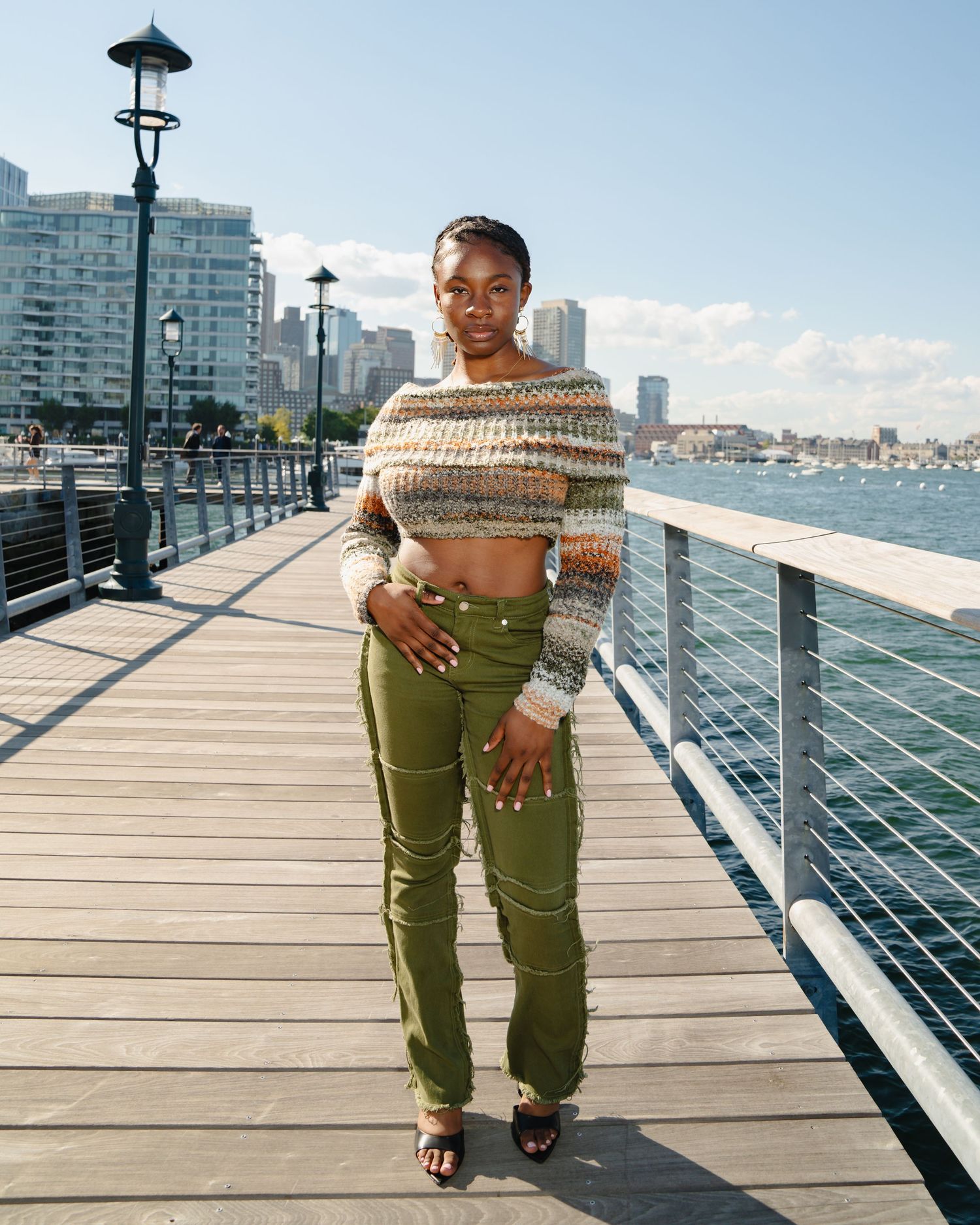 Series of photos on wooden boardwalk by waterfront showing person in olive green pants. Boston MA photographer, Malden MA and Greater Boston