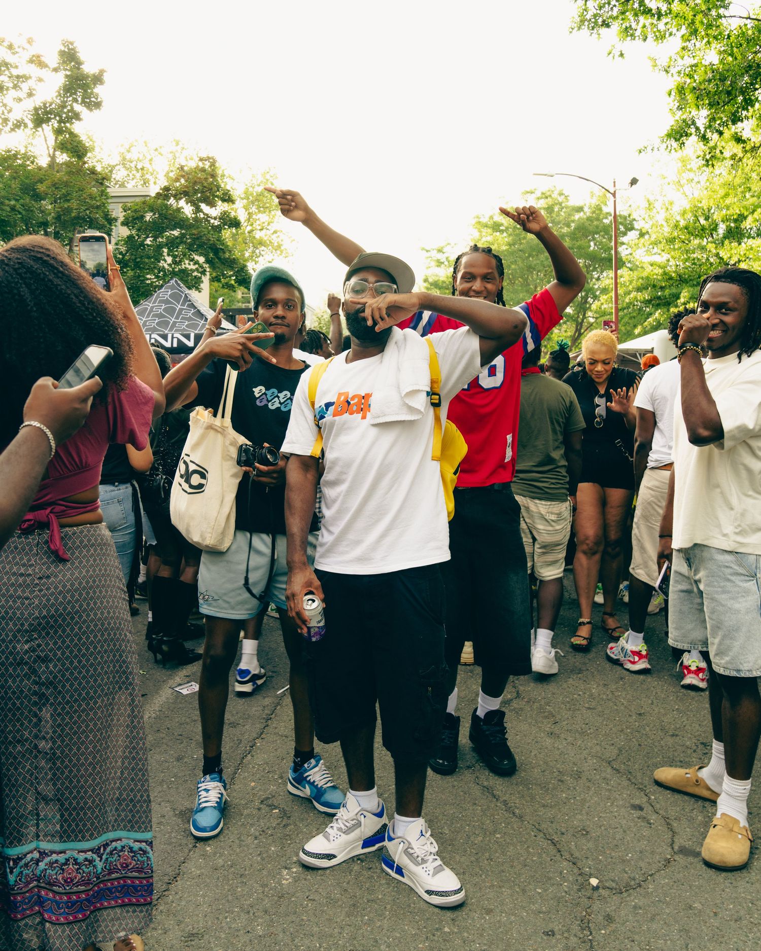 A group of people dancing and celebrating outdoors during a social gathering. Boston MA photographer, Malden MA and Greater Boston.