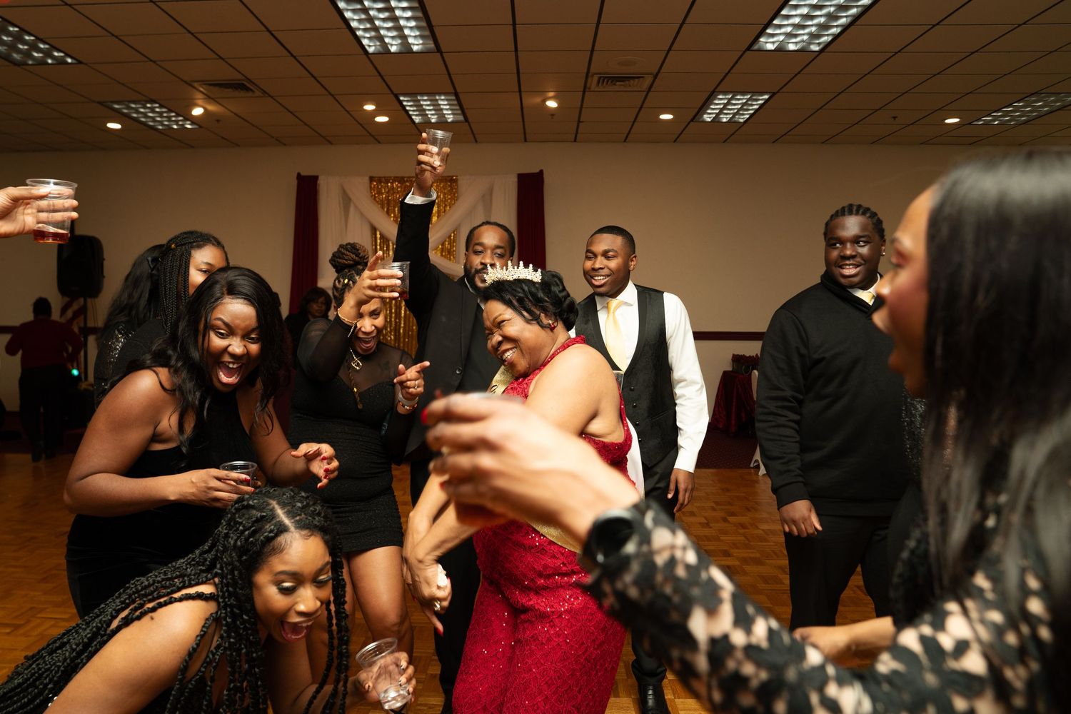 A group of people dancing and socializing birthday party. Boston MA photographer, Malden MA and Greater Boston.