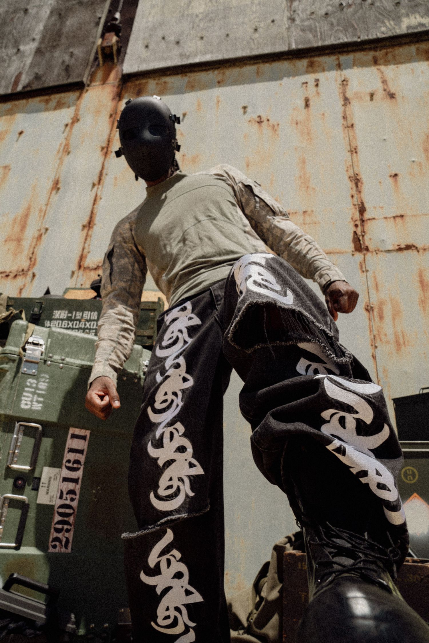 Urban streetwear featuring graphic designs photographed against industrial backdrop. Boston MA photographer, Malden MA & Greater Boston Area