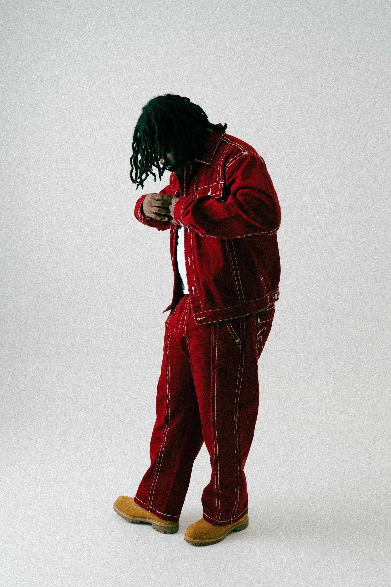 Red corduroy overalls with contrast stitching shown from multiple angles against a white background. Boston MA photographer, Malden MA.