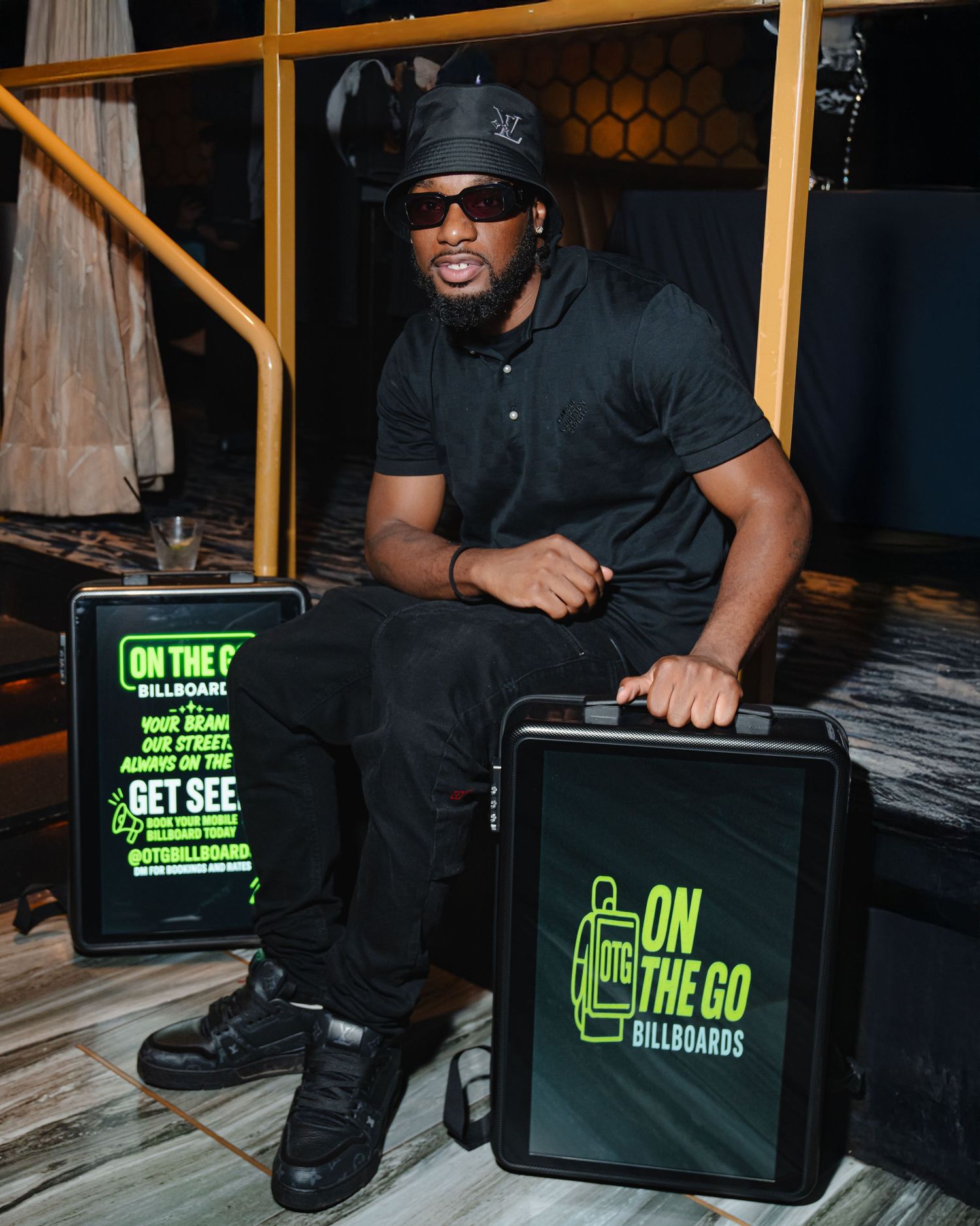 Black backpack with neon green branding displayed in sequence. Boston MA photographer, Malden MA and Greater Boston.