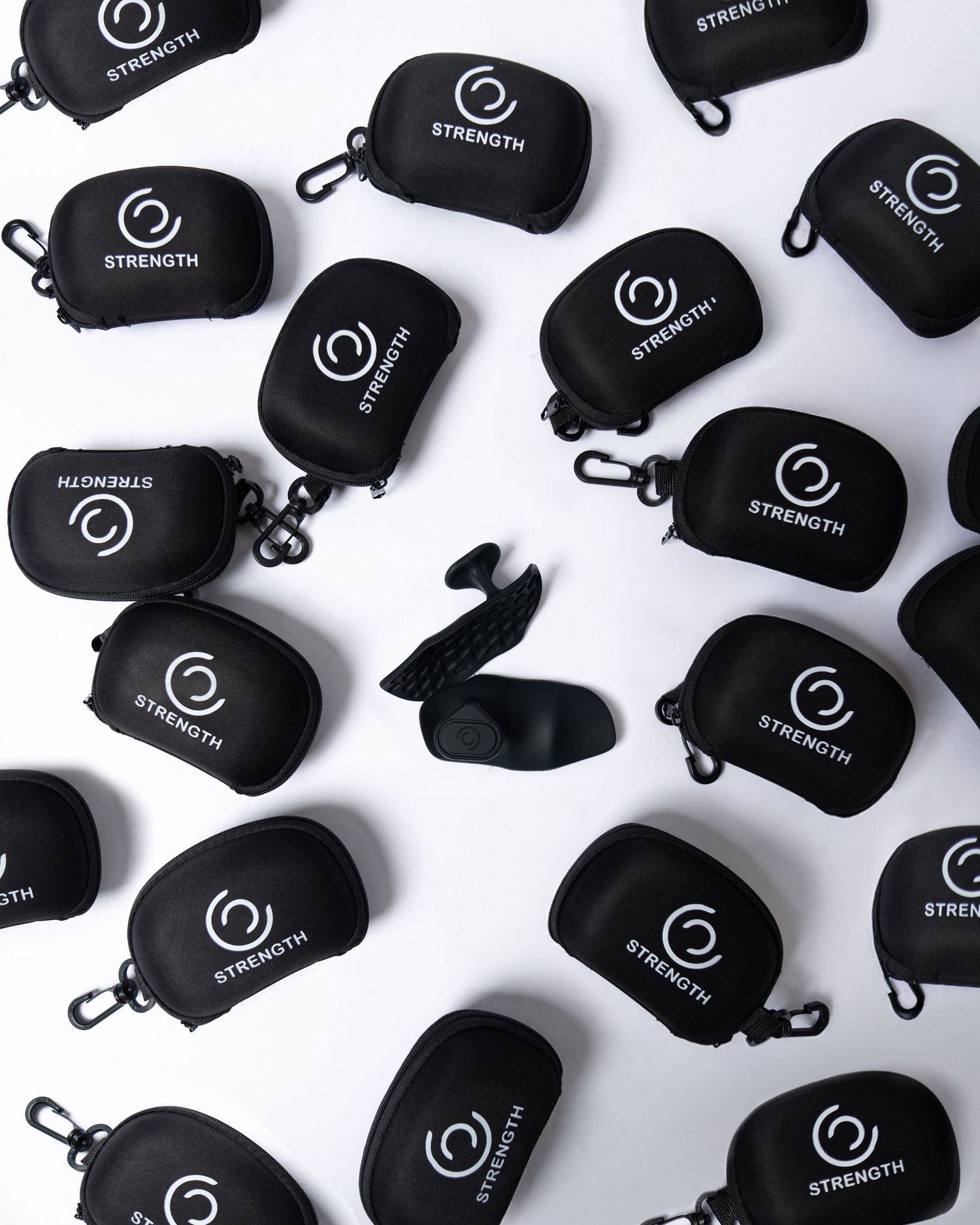 Multiple black cases with white logos arranged in a repeating pattern on white background. Boston MA photographer, Malden MA, Greater Boston