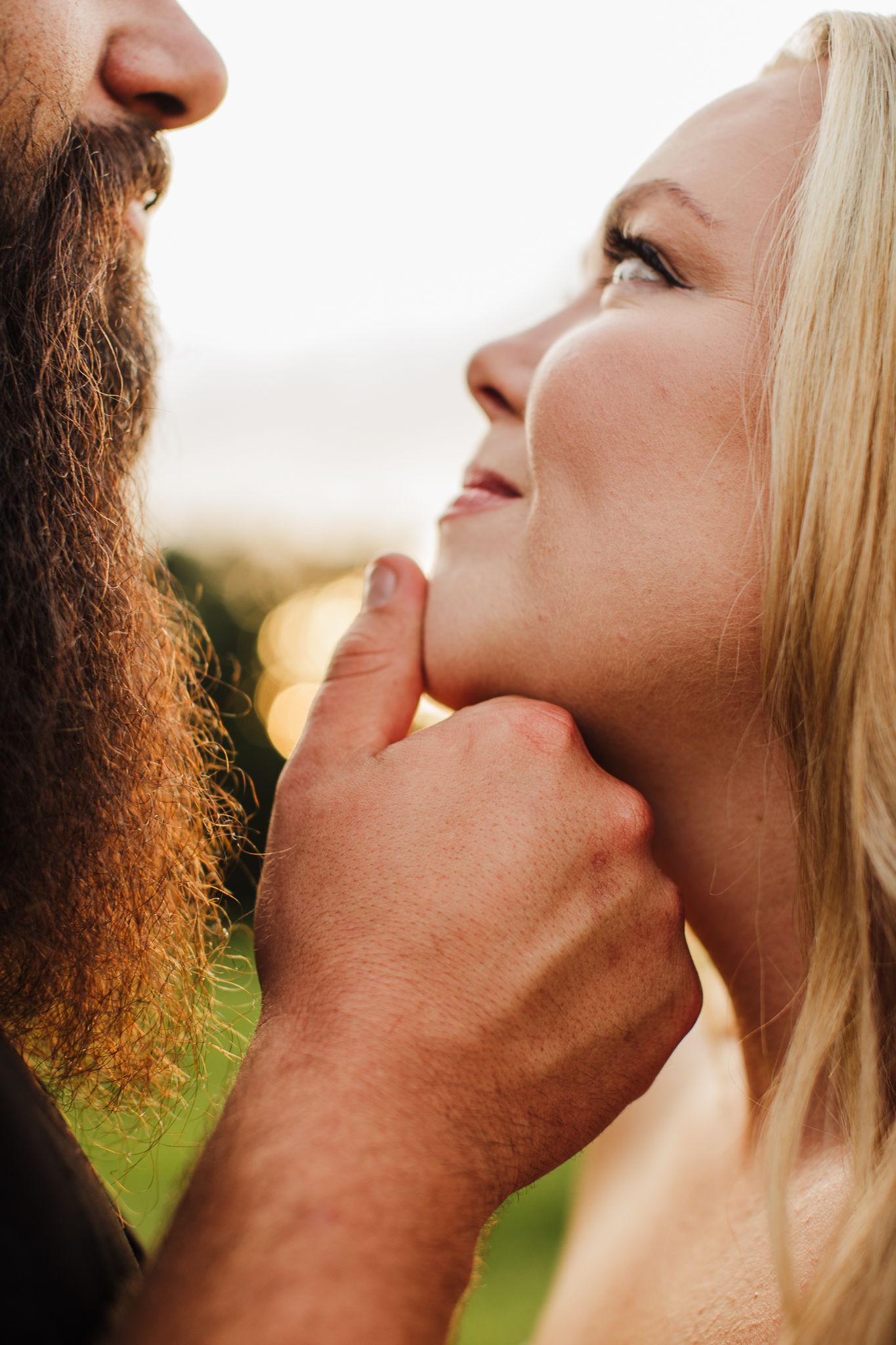 Close-up artistic shots showing intimate romantic moments in natural lighting.