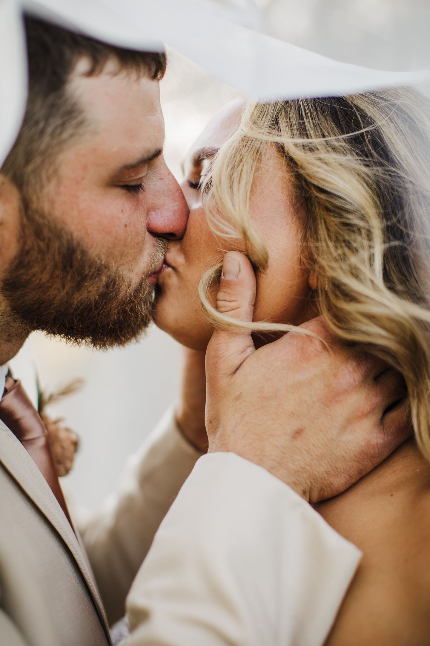 Intimate close-up wedding portrait showing tender romantic moment.