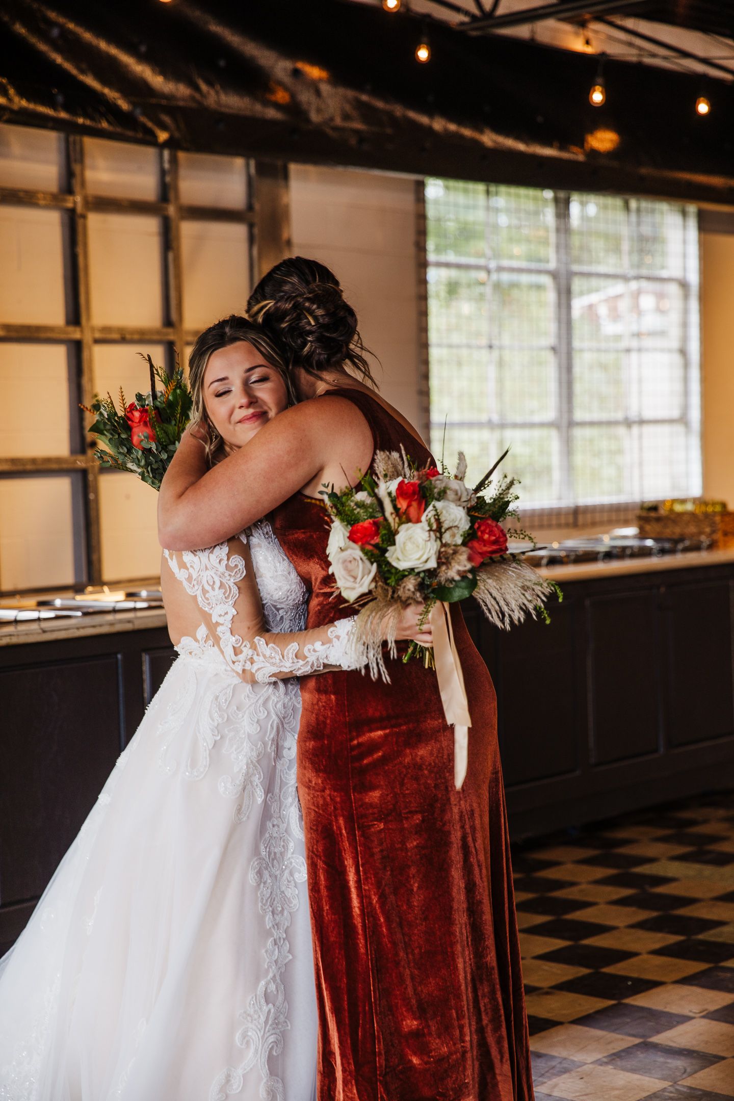 A sequence of emotional first look photos showing two people embracing in a venue with checkered floors and string lights.