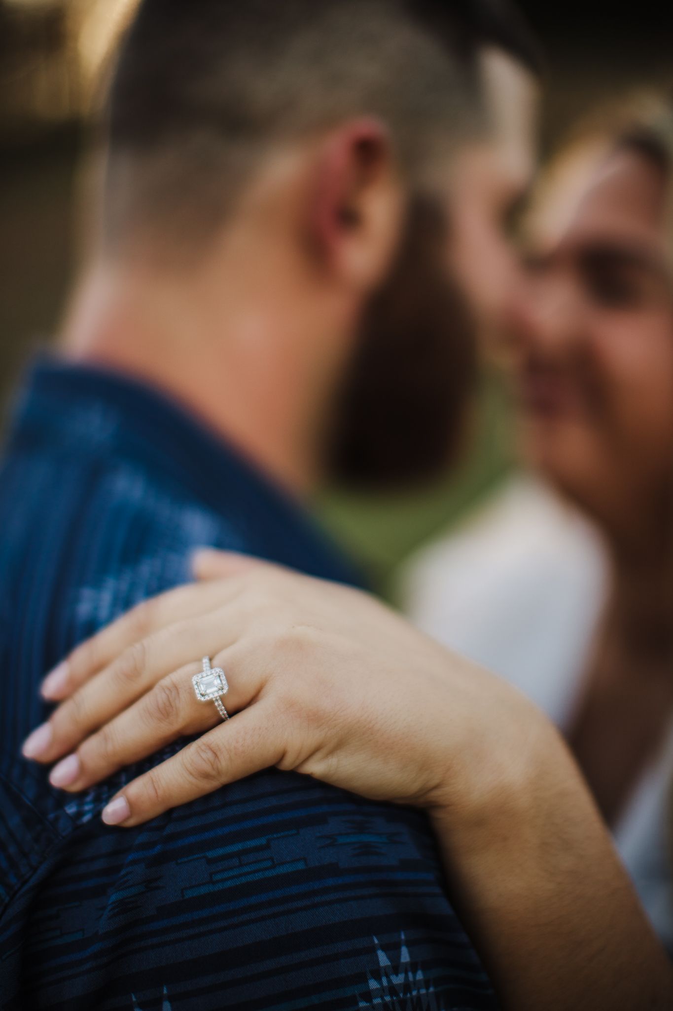 Close-up shots of hands and engagement ring against blue denim clothing.