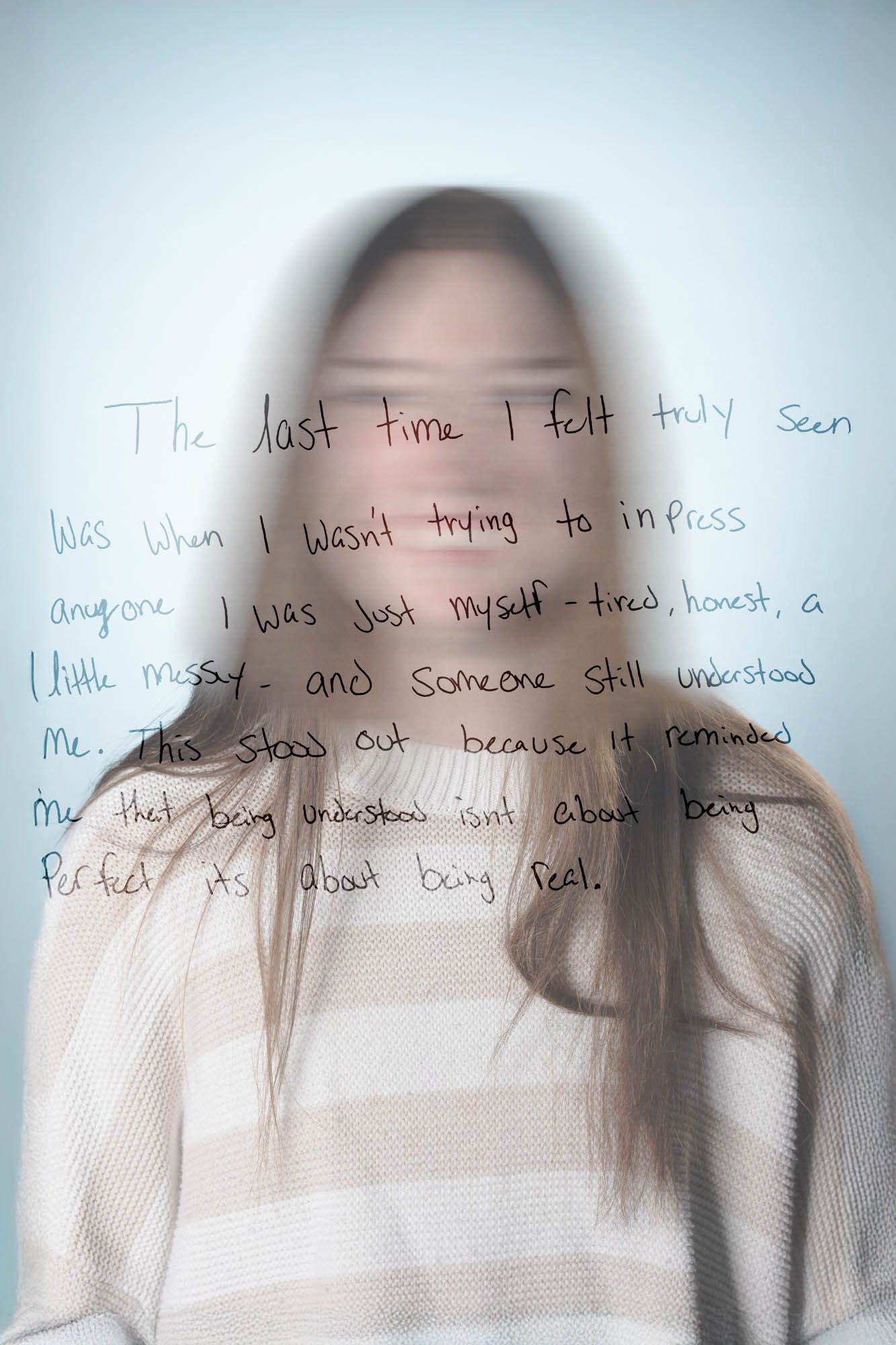 Blurred portrait of a woman with handwritten text about feeling understood without trying to impress anyone.