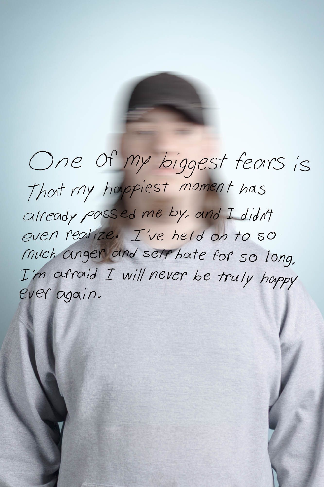 Blurred person in gray sweatshirt with text overlay expressing fear of never finding happiness again.